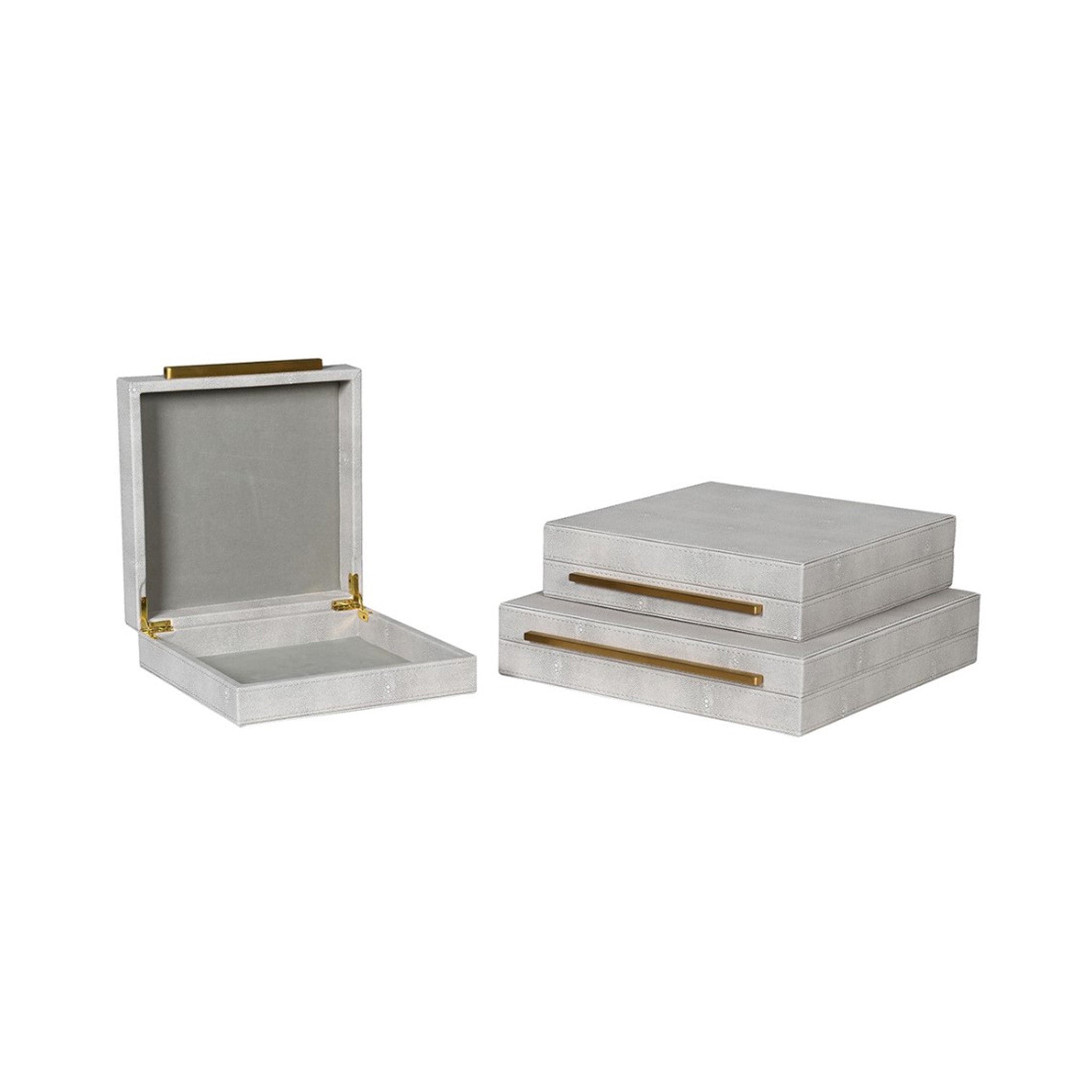 Set of 3 faux shagreen boxes in an ivory tone. All have a gold bar handle across the front opening
Dimensions: Large Box H:80 W:350 D:350 mm
Medium Box: H:80 W:300 D:300mm.
Small Box: H:80 W:250 D:250mm.